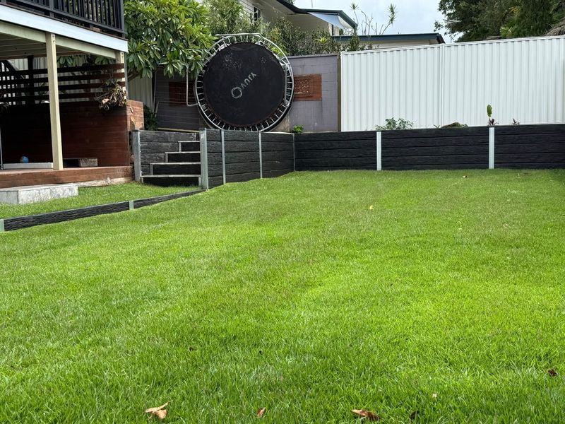 Fresh turf installation with retaining wall by BGL Services Brisbane