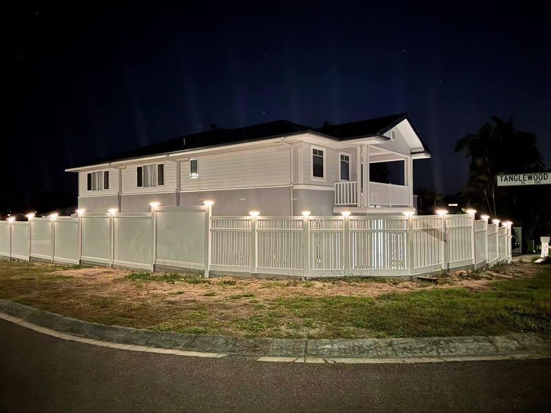 White picket fence with night lighting by BGL Services